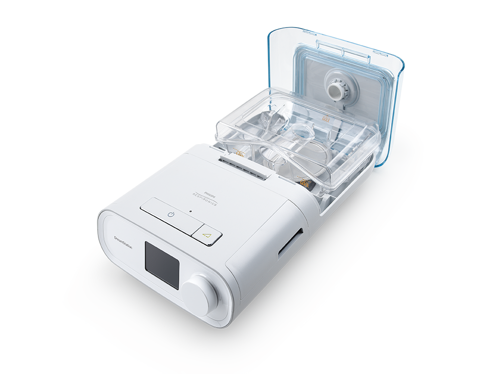 un appareil blanc avec un couvercle transparent