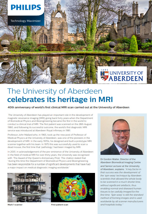 un homme &agrave; lunettes et une photo d'un b&acirc;timent