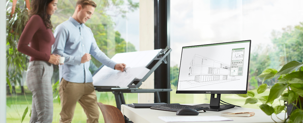 Les gens appr&eacute;cient le lieu de travail avec les moniteurs &eacute;cologiques et &agrave; faible impact de Philips.