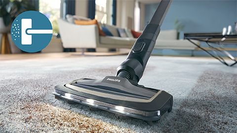 Le Philips AquaTrio sans fil Vacuum&nbsp;&&nbsp;Wash s&eacute;rie&nbsp;9000 nettoie une moquette et un tapis